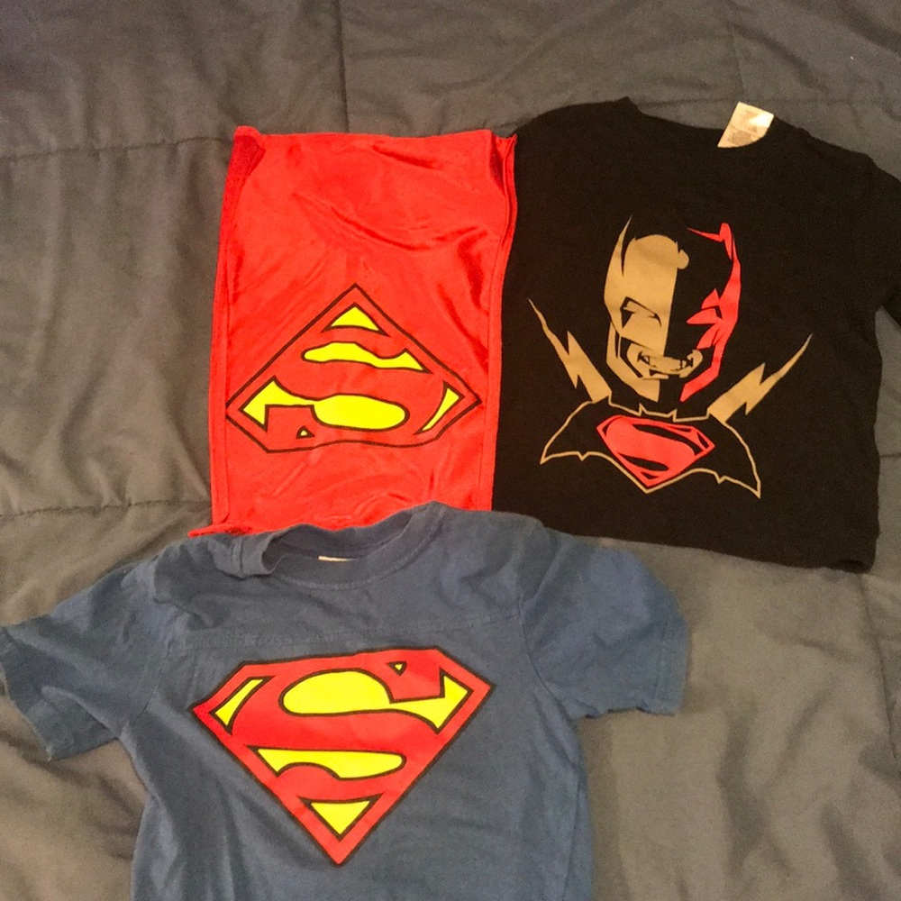 Two boys shirts. One with Cape